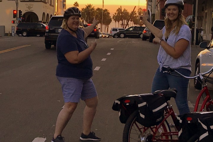 2 women posing at Venice beach.